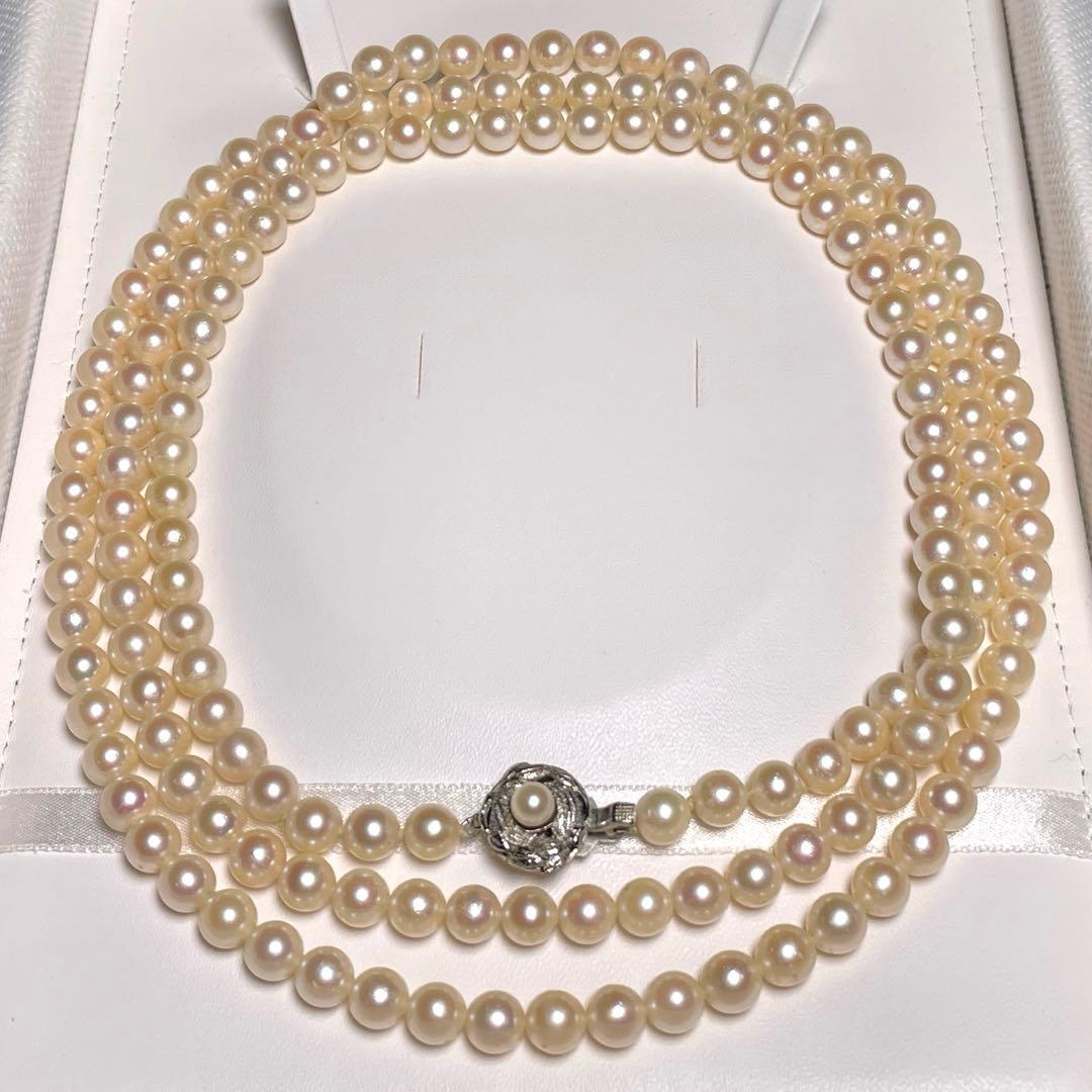 Akoya pearl long necklace with round white pearls 6.9-7.4mm in tsumami style on a silvery chain