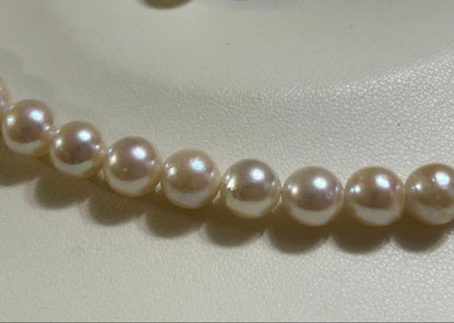 Akoya pearl necklace and matching earrings set with a 43 cm necklace length displayed on a white background