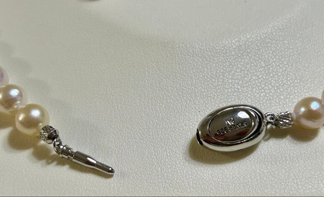 Akoya pearl necklace and matching earrings set with a 43 cm necklace length displayed on a white background