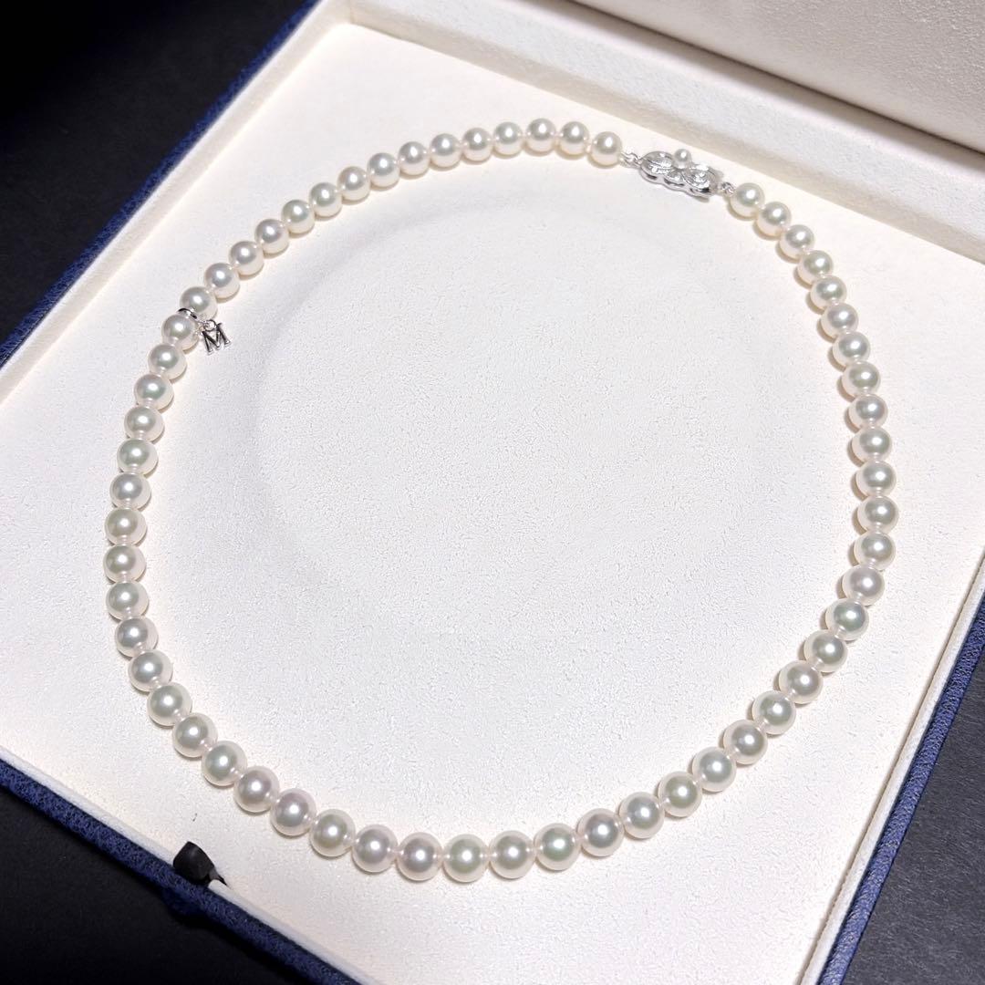 Mikimoto Akoya Pearl Necklace with 7.0 mm pearls and charm, 42cm length, displayed on white background