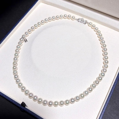 Mikimoto Akoya Pearl Necklace with 7.0 mm pearls and charm, 42cm length, displayed on white background