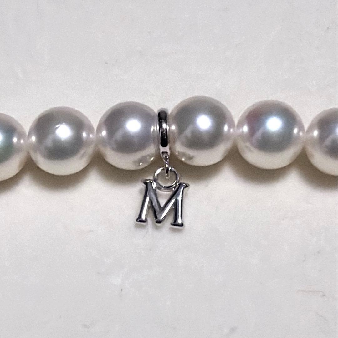 Mikimoto Akoya Pearl Necklace with 7.0 mm pearls and charm, 42cm length, displayed on white background