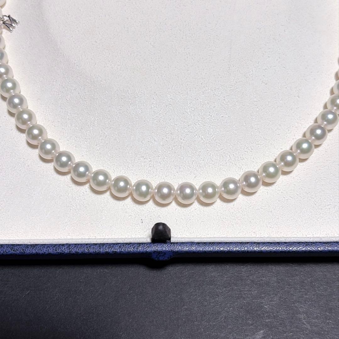 Mikimoto Akoya Pearl Necklace with 7.0 mm pearls and charm, 42cm length, displayed on white background