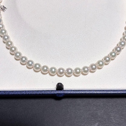 Mikimoto Akoya Pearl Necklace with 7.0 mm pearls and charm, 42cm length, displayed on white background