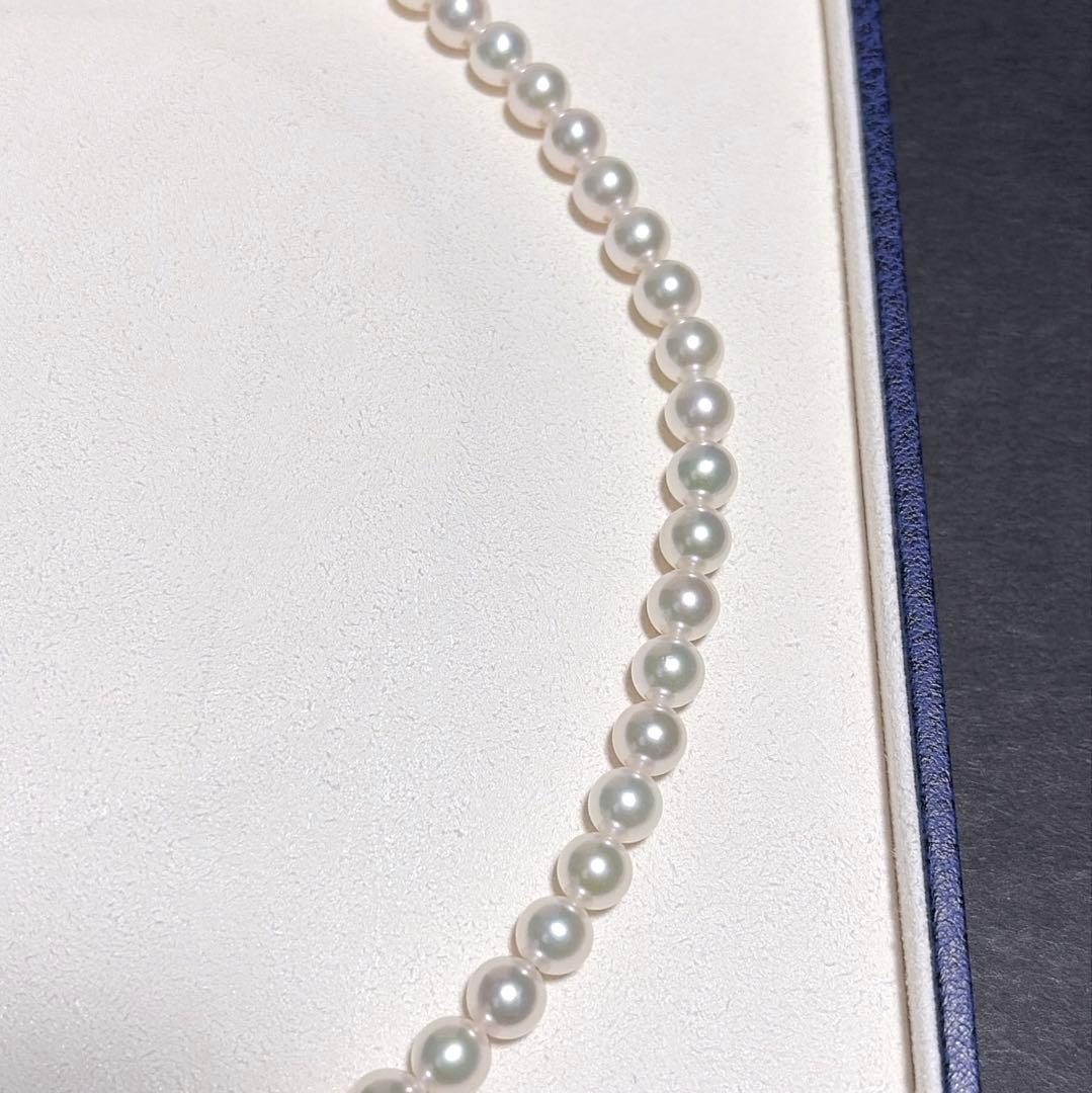 Mikimoto Akoya Pearl Necklace with 7.0 mm pearls and charm, 42cm length, displayed on white background