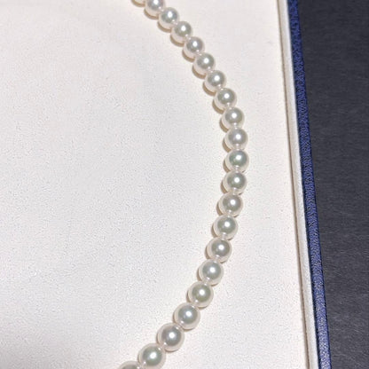 Mikimoto Akoya Pearl Necklace with 7.0 mm pearls and charm, 42cm length, displayed on white background