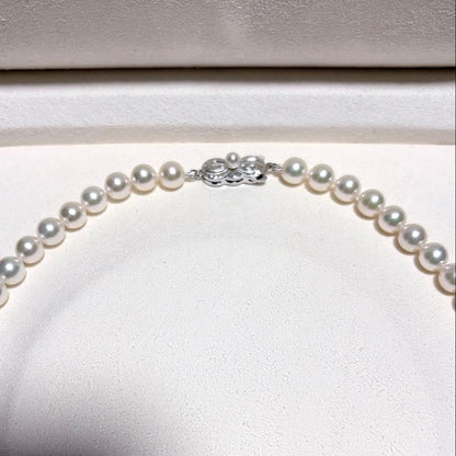 Mikimoto Akoya Pearl Necklace with 7.0 mm pearls and charm, 42cm length, displayed on white background