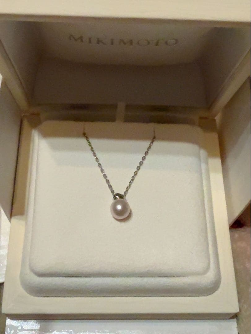 Mikimoto Pearl Pendant Necklace with simple design and adjustable chain displayed with gift box and ribbon