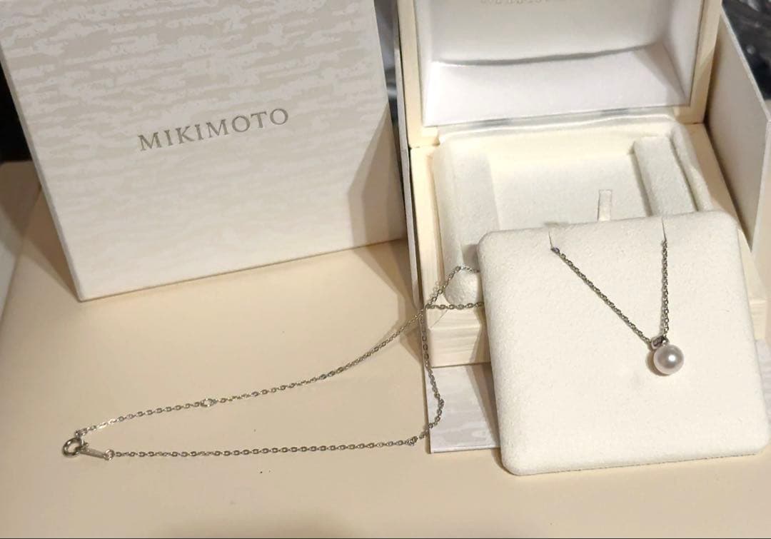 Mikimoto Pearl Pendant Necklace with simple design and adjustable chain displayed with gift box and ribbon