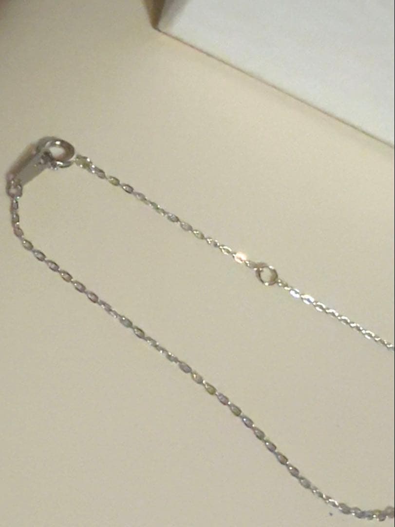 Mikimoto Pearl Pendant Necklace with simple design and adjustable chain displayed with gift box and ribbon