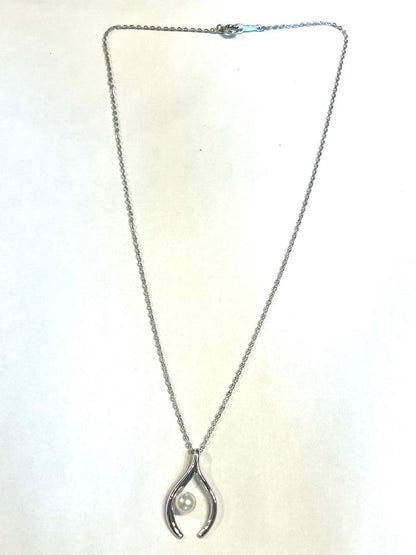 Mikimoto silver pearl necklace with 2.5 x 1.5 cm pendant and 39 cm chain on white background