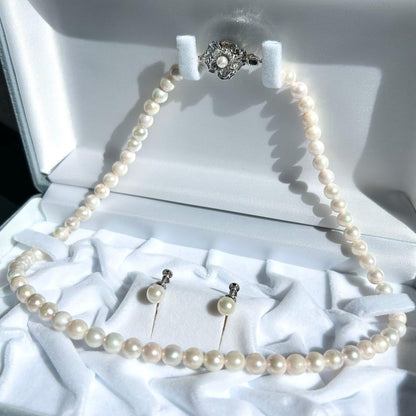 Earring set featuring 6.5-6mm Akoya pearls with matching 43 cm pearl necklace