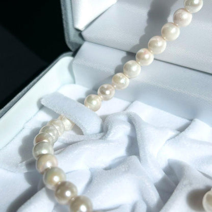 Earring set featuring 6.5-6mm Akoya pearls with matching 43 cm pearl necklace