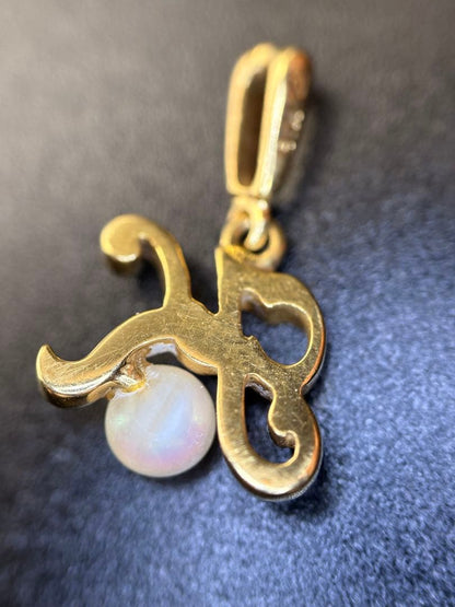 Mikimoto K18 gold necklace with baby Akoya pearl pendant in the shape of an initial letter