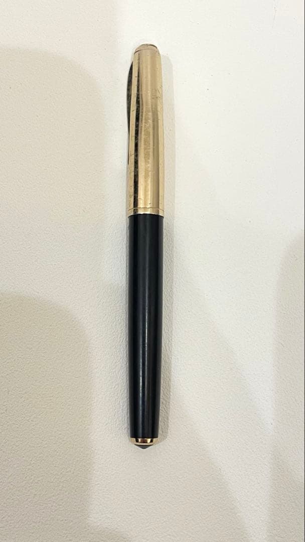 PILOT Fountain Pen with 14K gold nib and sleek black barrel, elegant writing instrument