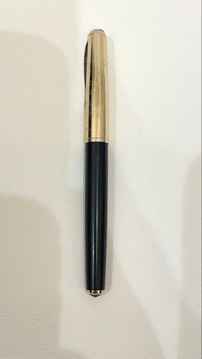 PILOT Fountain Pen with 14K gold nib and sleek black barrel, elegant writing instrument