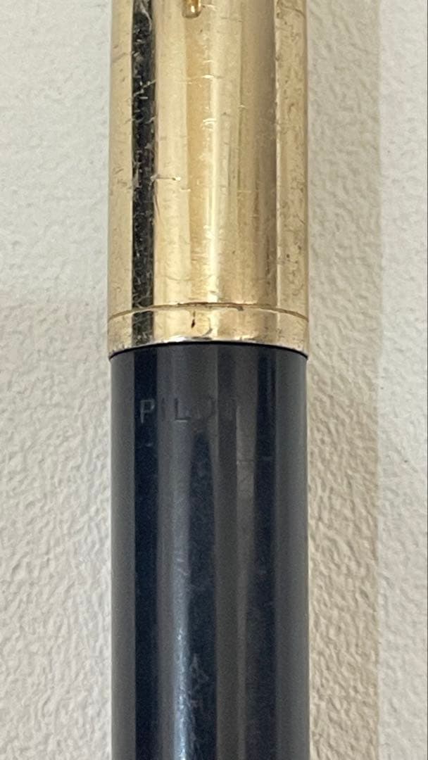 PILOT Fountain Pen with 14K gold nib and sleek black barrel, elegant writing instrument
