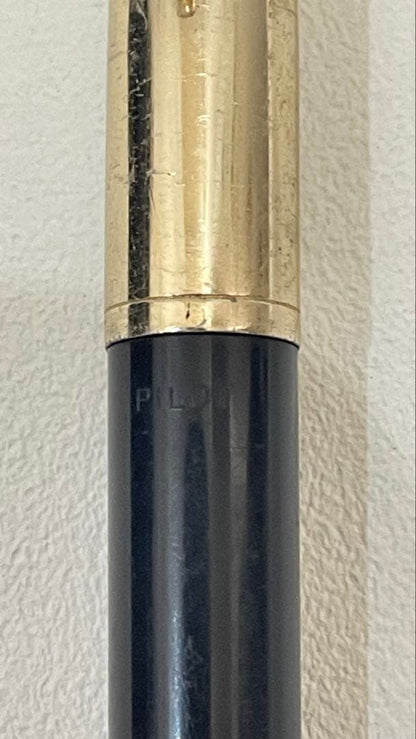 PILOT Fountain Pen with 14K gold nib and sleek black barrel, elegant writing instrument