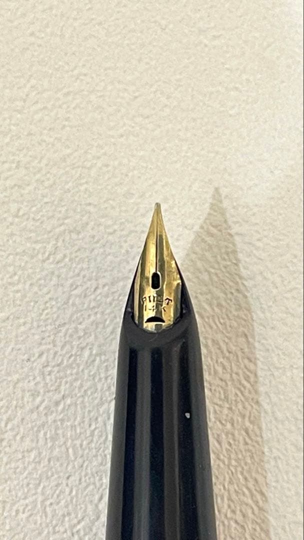 PILOT Fountain Pen with 14K gold nib and sleek black barrel, elegant writing instrument