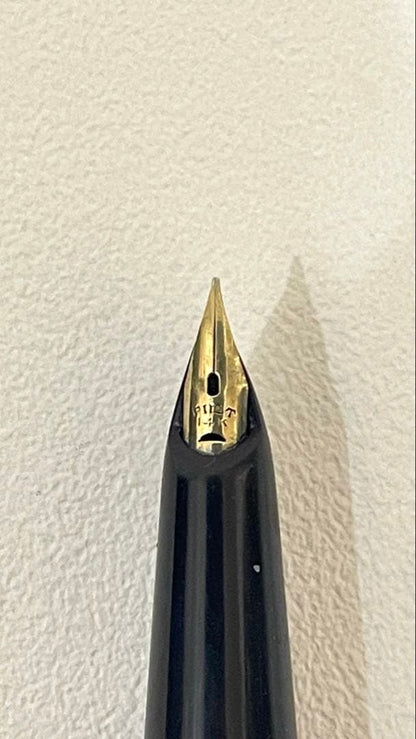 PILOT Fountain Pen with 14K gold nib and sleek black barrel, elegant writing instrument