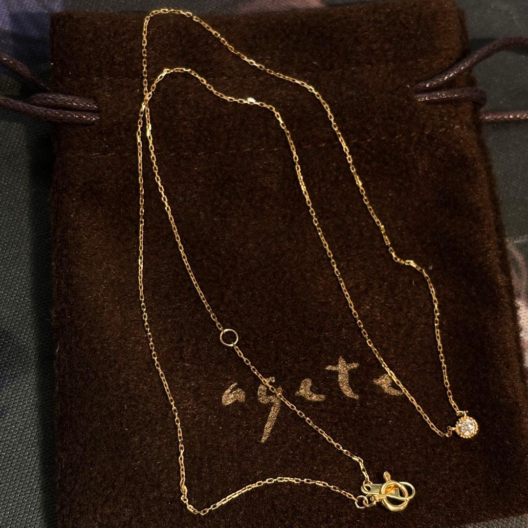 Agete K18 yellow gold necklace with millegrain diamond accents and single Akoya pearl on adjustable 40 cm chain