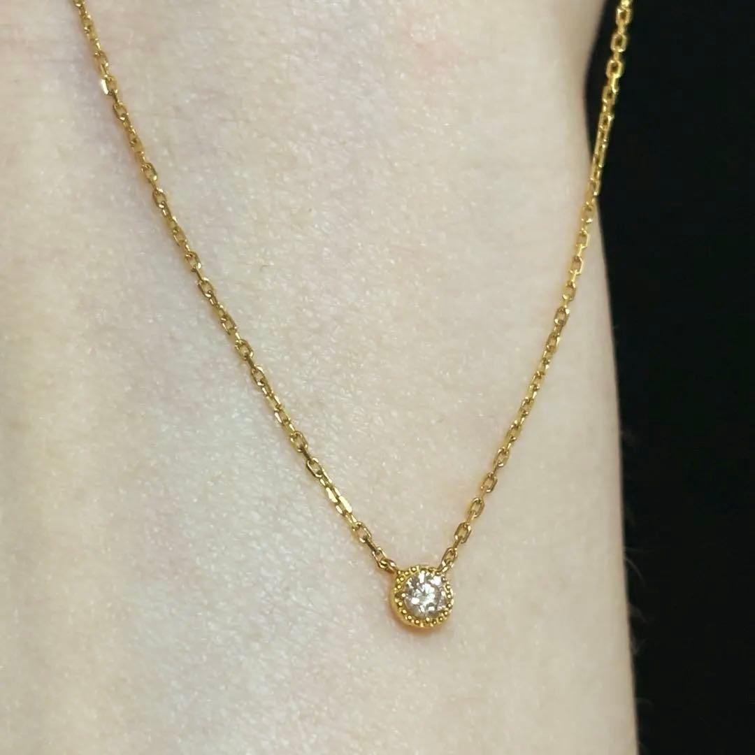 Agete K18 yellow gold necklace with millegrain diamond accents and single Akoya pearl on adjustable 40 cm chain