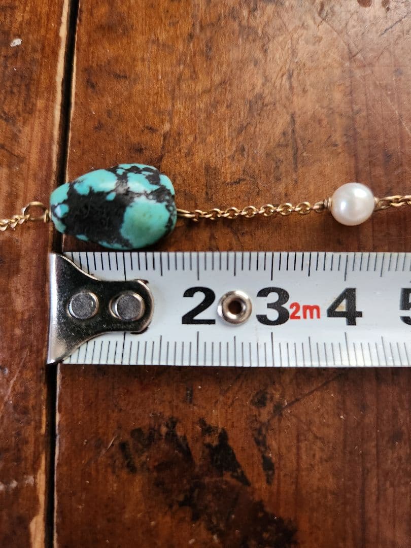 ajete Select Antique Necklace with 44cm gold chain, turquoise decoration, and pearl accents