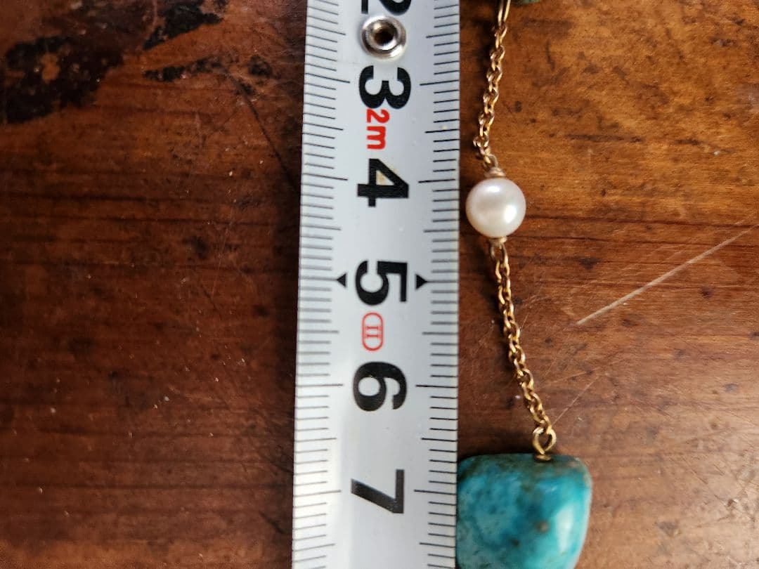 ajete Select Antique Necklace with 44cm gold chain, turquoise decoration, and pearl accents