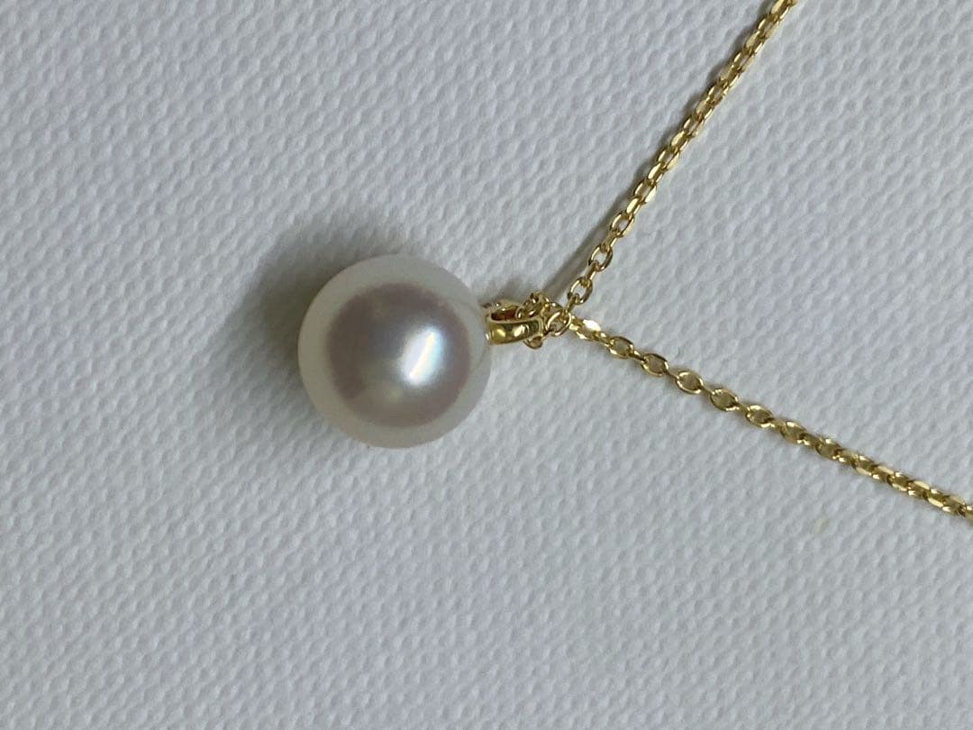 Tasaki K18 gold necklace featuring an 8mm Akoya pearl and a small diamond on a koza chain