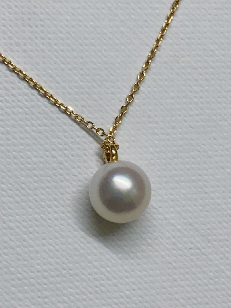 Tasaki K18 gold necklace featuring an 8mm Akoya pearl and a small diamond on a koza chain