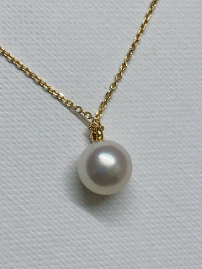 Tasaki K18 gold necklace featuring an 8mm Akoya pearl and a small diamond on a koza chain