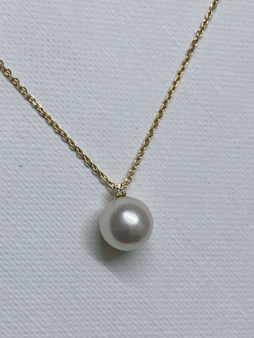 Tasaki K18 gold necklace featuring an 8mm Akoya pearl and a small diamond on a koza chain