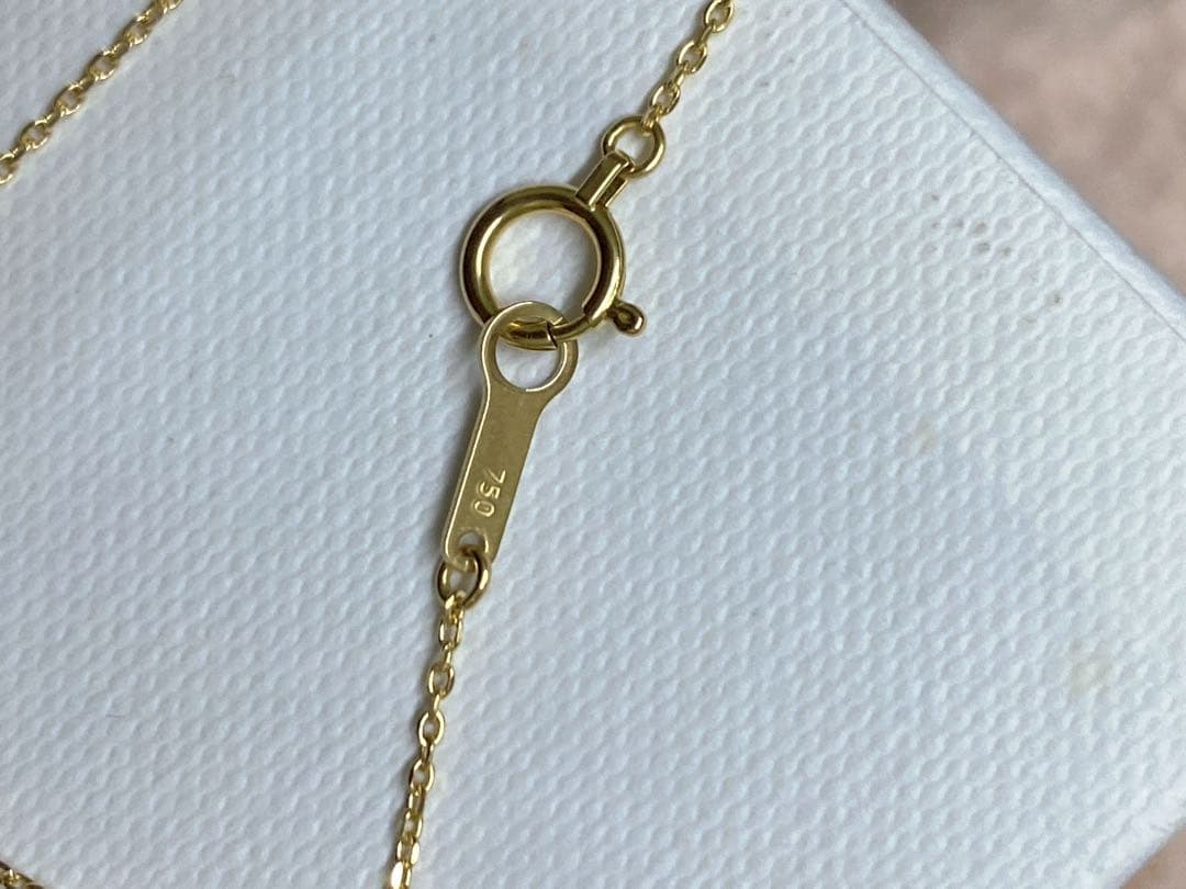Tasaki K18 gold necklace featuring an 8mm Akoya pearl and a small diamond on a koza chain