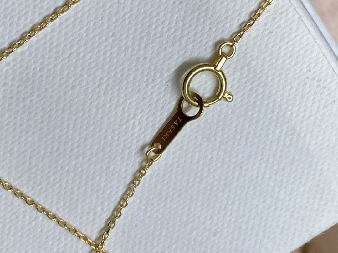 Tasaki K18 gold necklace featuring an 8mm Akoya pearl and a small diamond on a koza chain