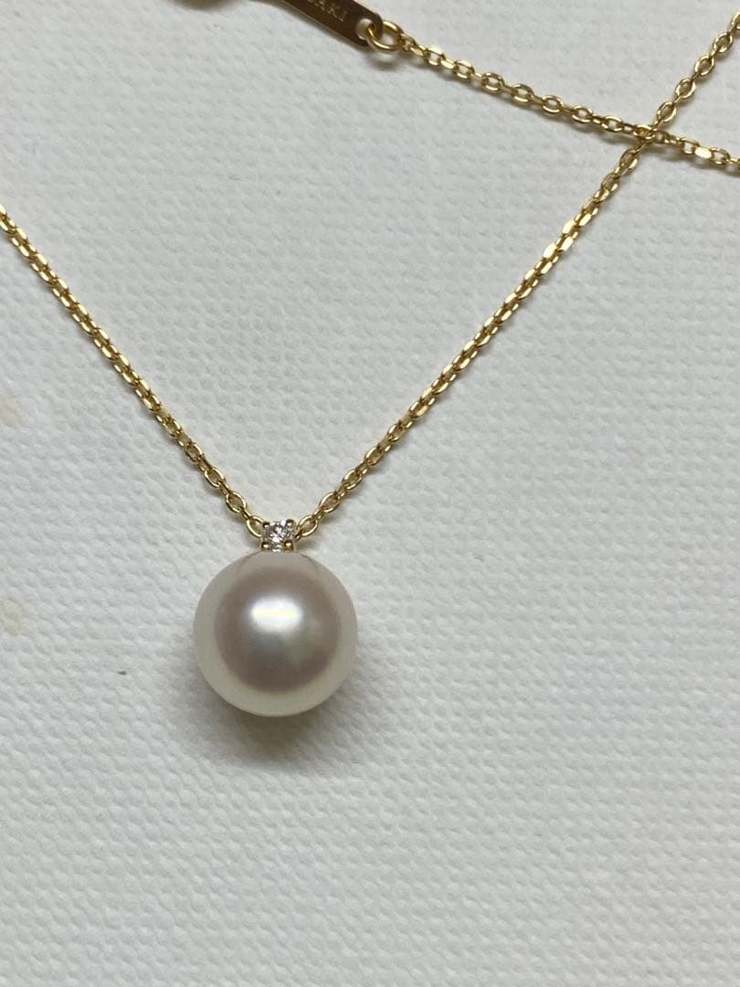 Tasaki K18 gold necklace featuring an 8mm Akoya pearl and a small diamond on a koza chain