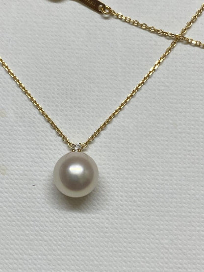 Tasaki K18 gold necklace featuring an 8mm Akoya pearl and a small diamond on a koza chain