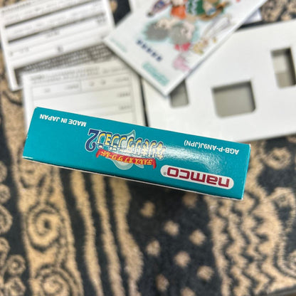 Tales of the World NariKiri Dungeon 2 Game Boy Advance game cartridge and packaging with manual