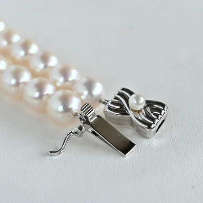 Takashi Akoya pearl necklace with 8-7.5mm pearls and ribbon clasp, 42cm length