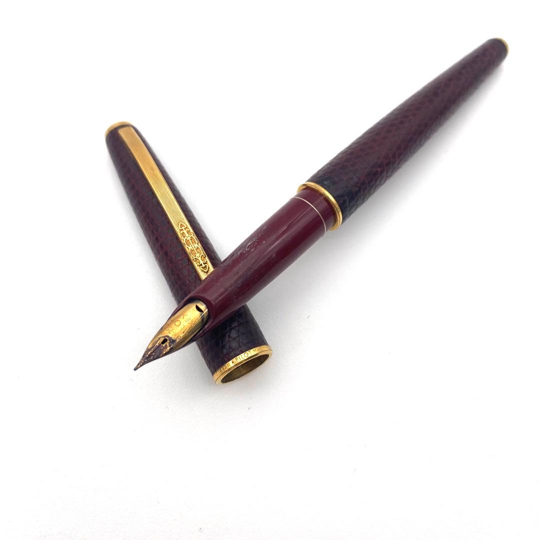 Pilot K18 fountain pen in Bordeaux color with gold trim and engraved clip shown against white background