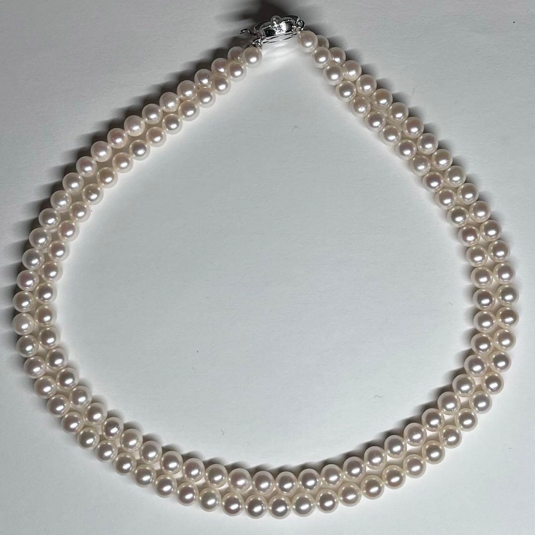 Akoya pearl 2-strand necklace with 5.8-6.5mm pearls and silver clasp on white background