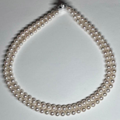 Akoya pearl 2-strand necklace with 5.8-6.5mm pearls and silver clasp on white background