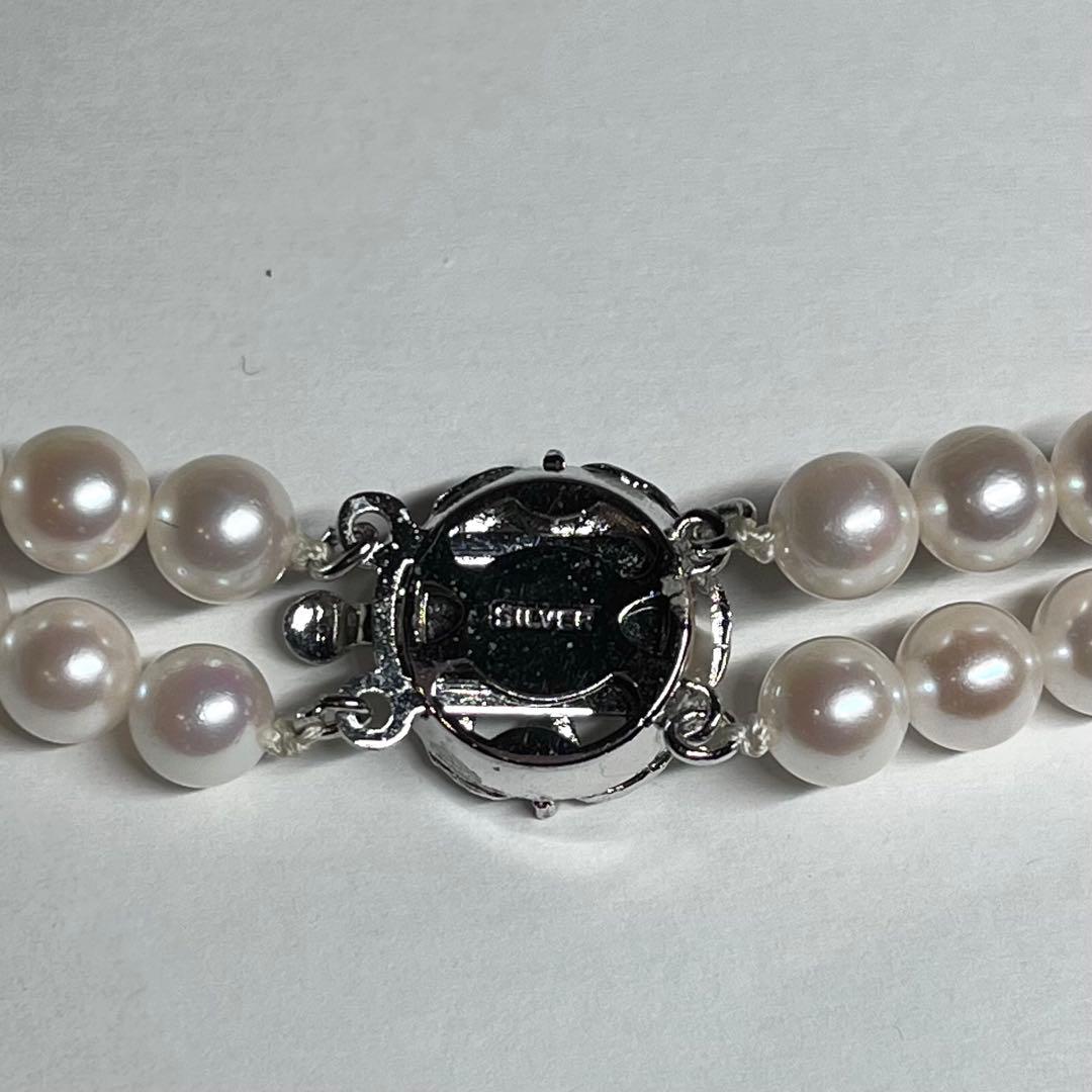 Akoya pearl 2-strand necklace with 5.8-6.5mm pearls and silver clasp on white background