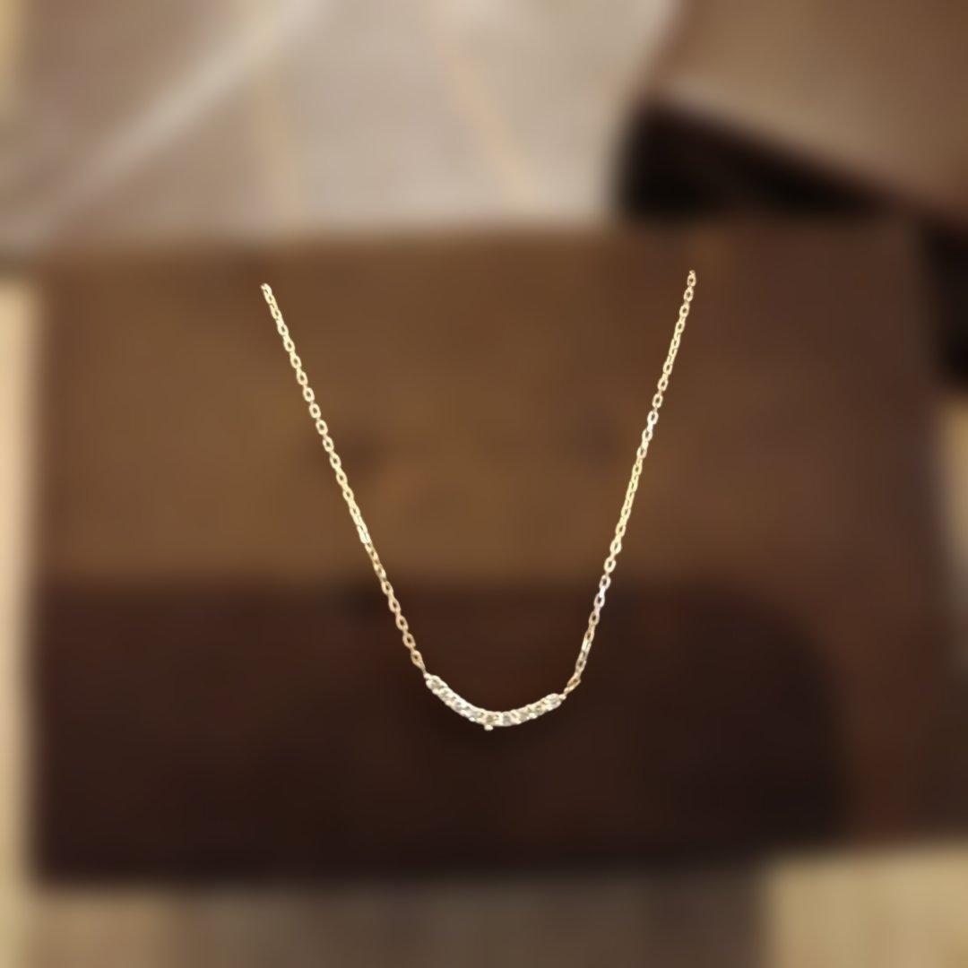 K18 gold necklace with 0.04ct diamond pendant by agete, model 10174116089, on white background