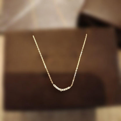 K18 gold necklace with 0.04ct diamond pendant by agete, model 10174116089, on white background