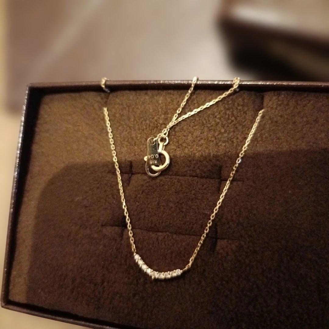 K18 gold necklace with 0.04ct diamond pendant by agete, model 10174116089, on white background