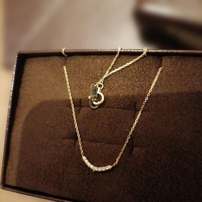 K18 gold necklace with 0.04ct diamond pendant by agete, model 10174116089, on white background