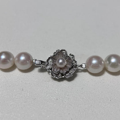 Akoya pearl necklace with 8.5-9mm pearls and silver stamped metal fittings measuring 43.5 cm