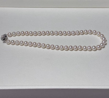 Akoya pearl necklace with 8.5-9mm pearls and silver stamped metal fittings measuring 43.5 cm