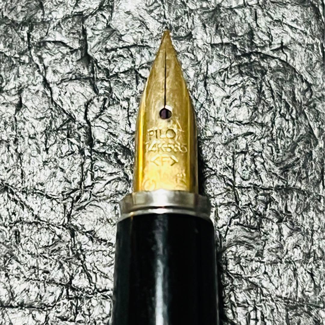 Two Pilot 14K U Fountain Pens from 1974 with fine nib size shown side by side