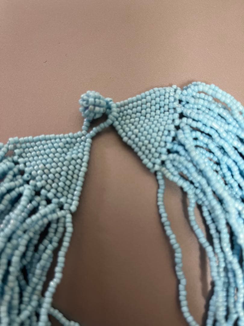 agete turquoise blue beads multi-layer necklace with knotted clasp displayed on white background